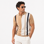 Man wearing a striped polo shirt and sunglasses on a white background