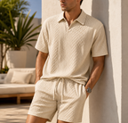 Cream textured short sleeve polo shirt and matching shorts, upper body detail view.