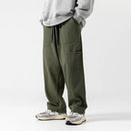 Men's Cotton Drawstring Straight Leg Pants in beige — full front view on model