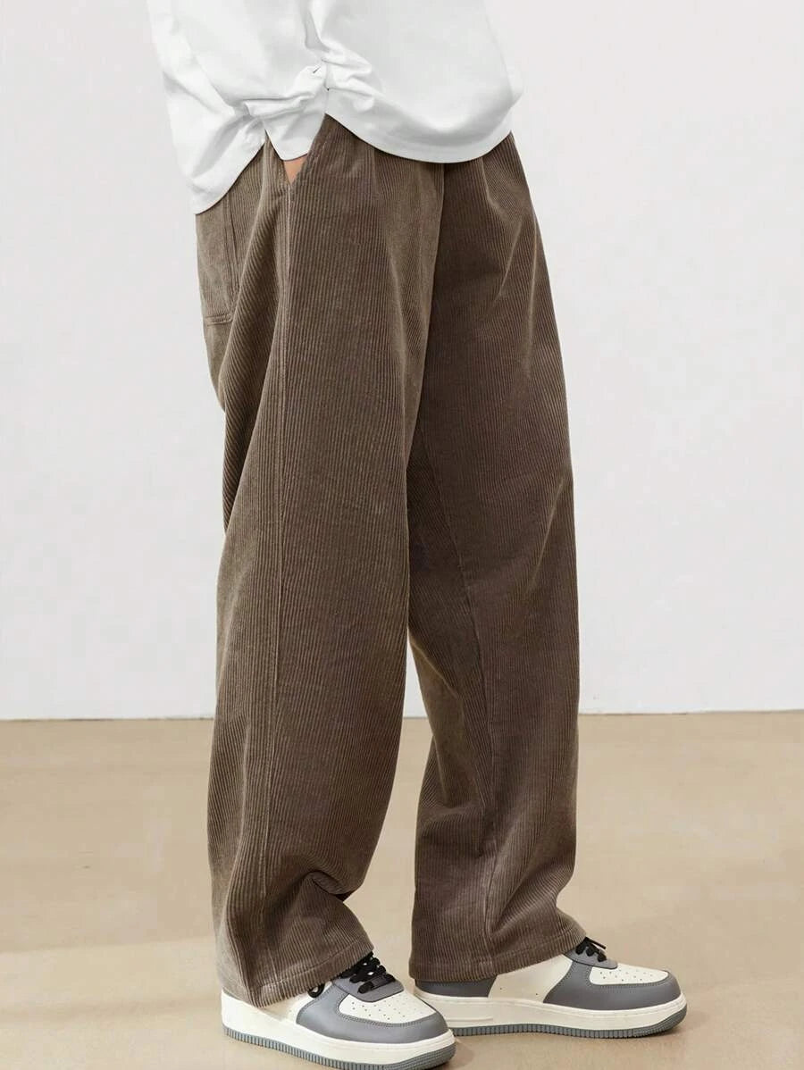 Men's Loose Fit Corduroy Straight Pants in brown — full front view on model