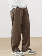 Men's Loose Fit Corduroy Straight Pants in brown — full front view on model