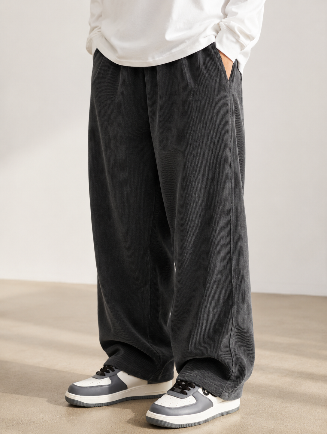 Men's Loose Fit Corduroy Straight Pants in brown — hem and leg opening detail