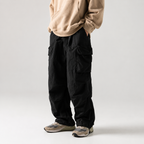 Men's Loose Fit Pocket Cargo Pants in brown — full front view on model
