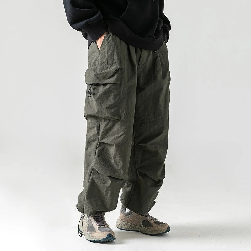 Men's Loose Fit Pocket Cargo Pants in brown — lifestyle shot