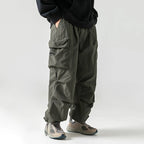 Men's Loose Fit Pocket Cargo Pants in brown — lifestyle shot