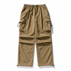 Men's Loose Fit Pocket Cargo Pants in brown — side view with cargo pocket