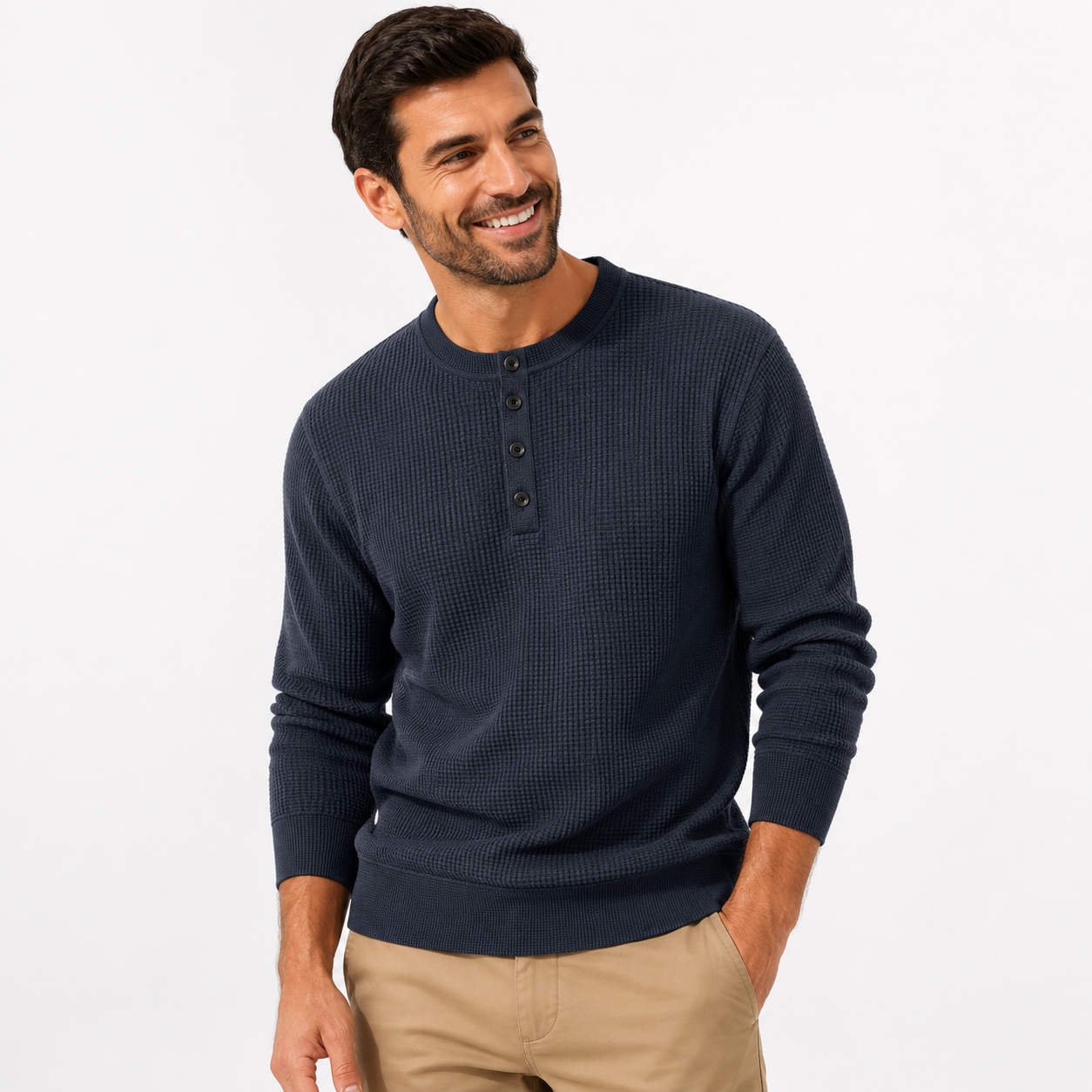 Man wearing a navy blue henley sweater on a white background