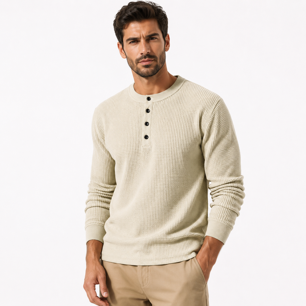 Man wearing a beige long-sleeve shirt with buttons on a white background