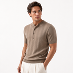 Man wearing a beige ribbed short-sleeve shirt on a white background