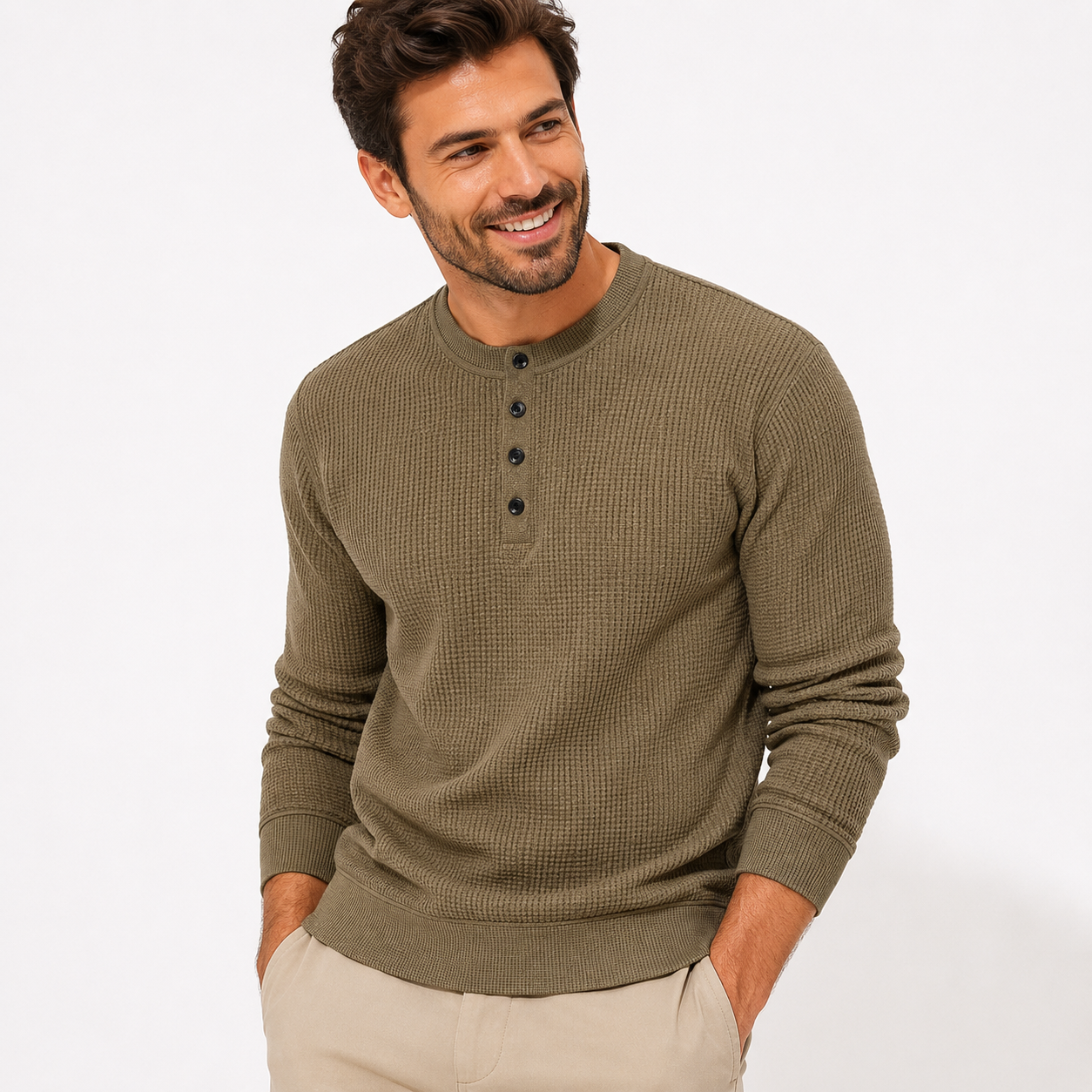 Man wearing a green henley sweater on a white background