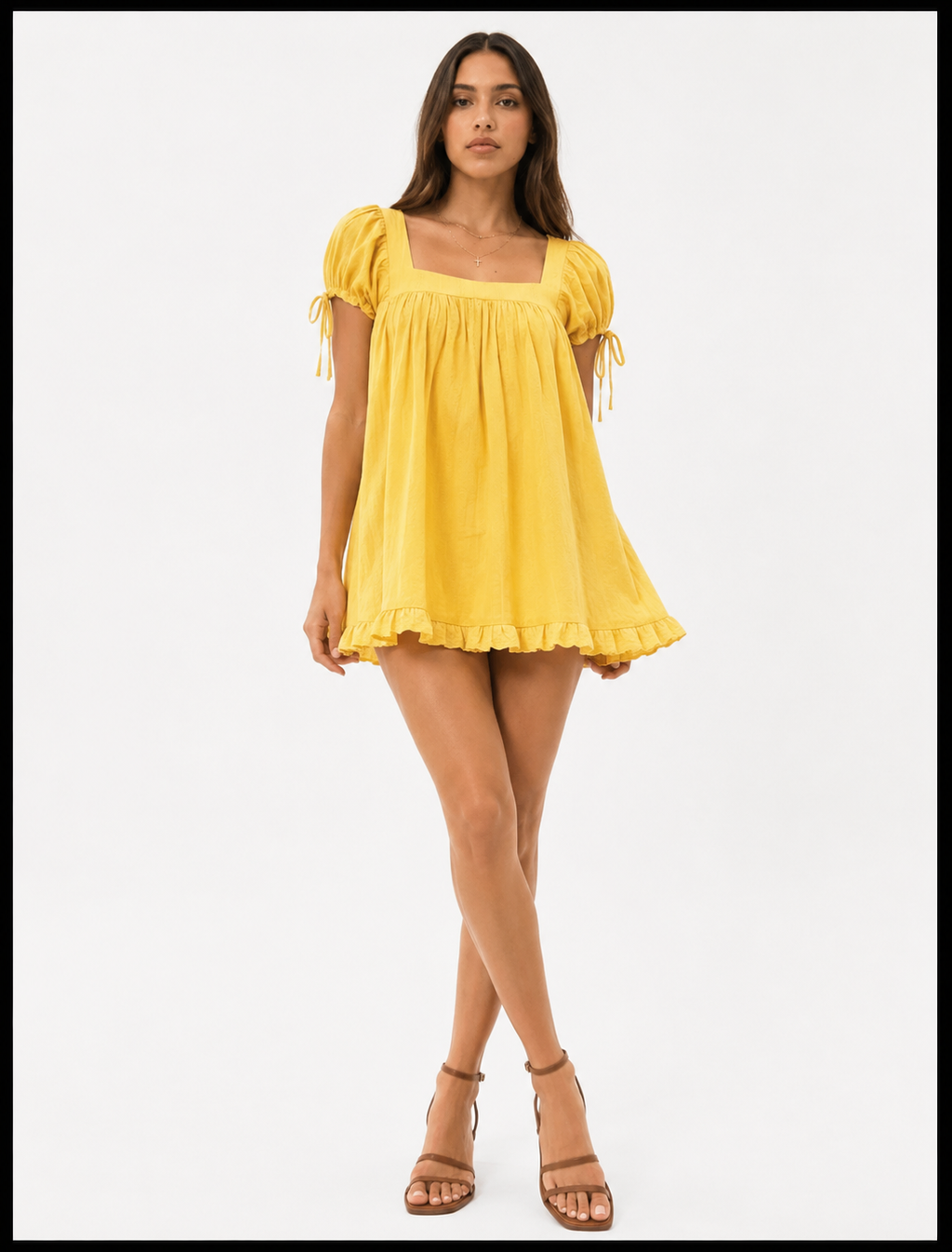 Woman wearing a yellow dress on a white background