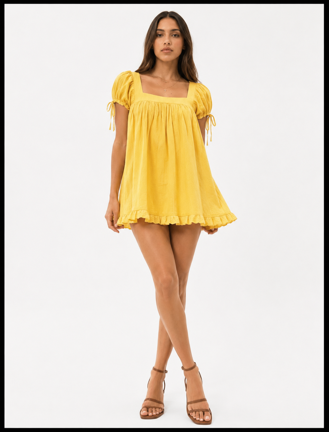 Woman wearing a yellow dress on a white background